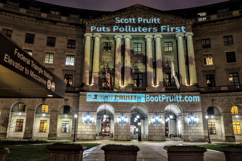 EPA headquarters illuminated with a message calling for Administrator Scott Pruitt to be fired.