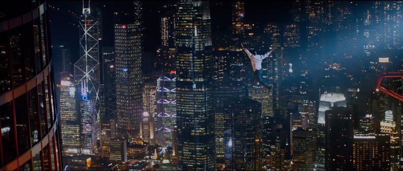 Will Sawyer (Dwayne Johnson) jumps from a crane to a skyscraper in Skyscraper