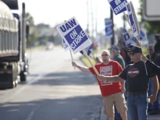 After losing more than $1 billion, GM makes a deal with striking workers