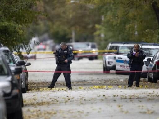 Two gunmen wound 13 at a Chicago house party honoring a gun violence victim