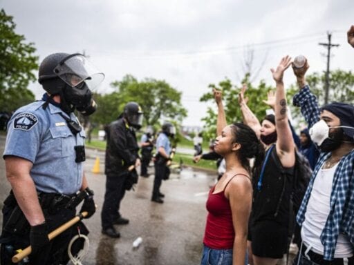 Photos capture the stark contrast in police response to George Floyd protests vs. anti-lockdown protests