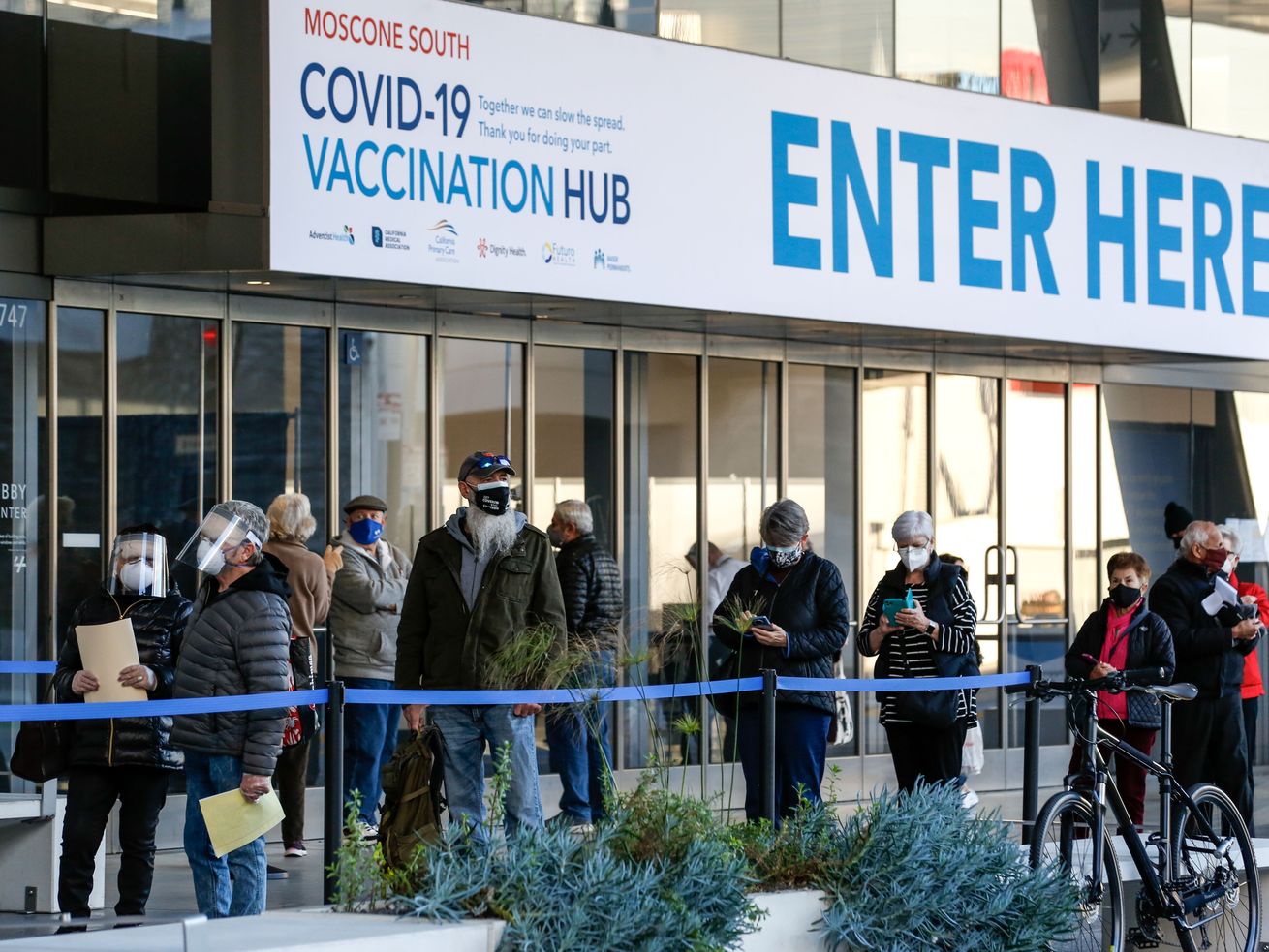 Some front-line workers are now eligible for the vaccine. Employers might pay them to get it.