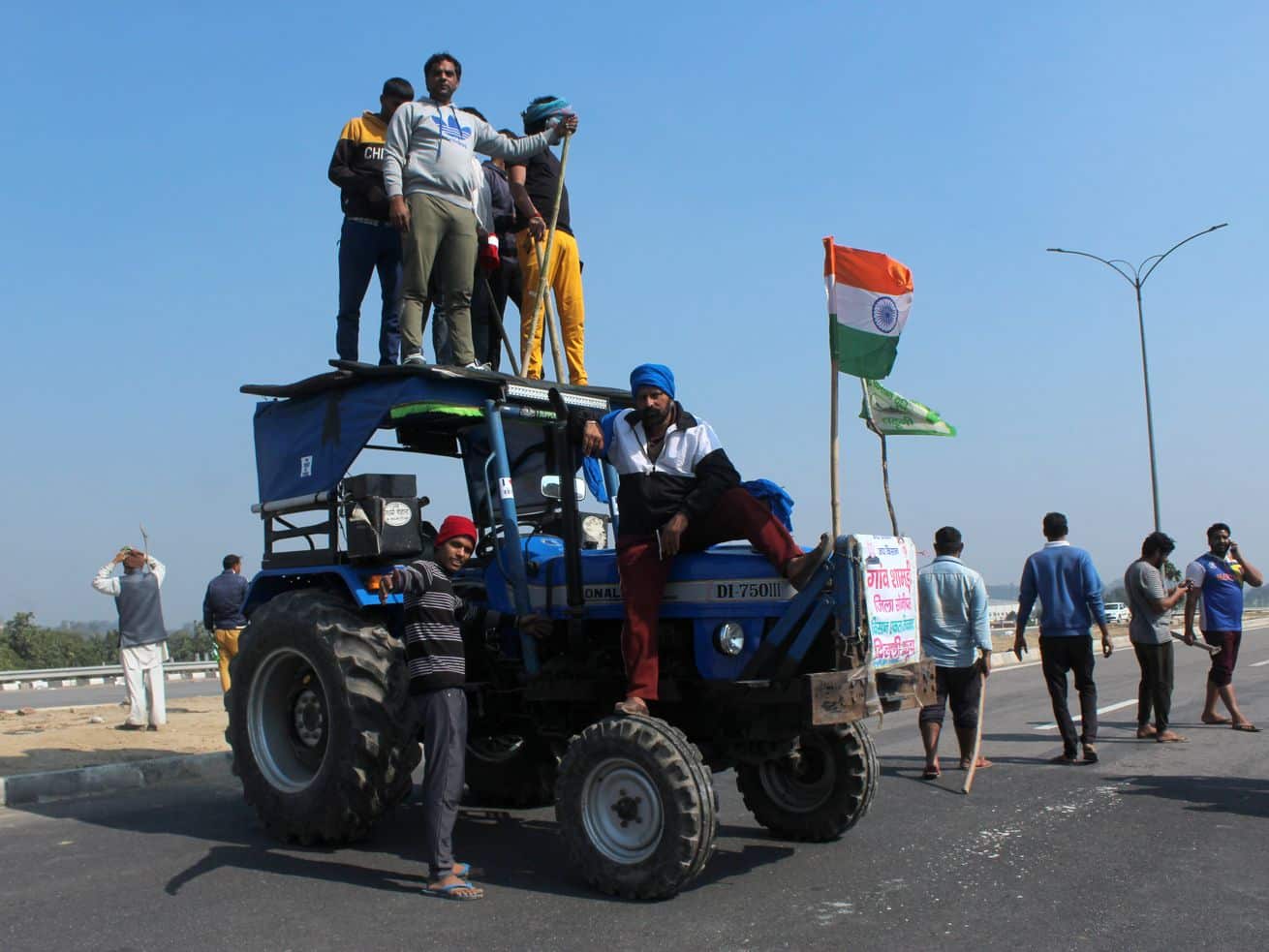 Tens of thousands of farmers protest agriculture laws with blockades across India